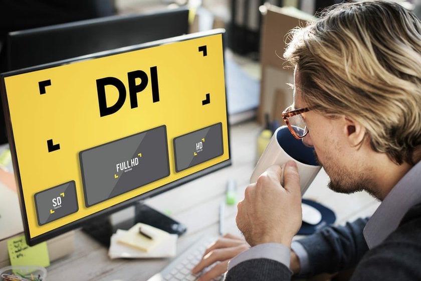 Man Looking at a Monitor Showing the Difference Between Images with Different DPI | Skylum Blog