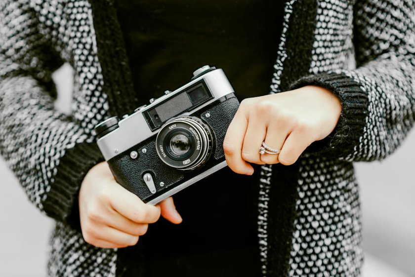 Girl Holding a Retro Camera in Her Hands | Skylum Blog