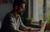 A man works on a computer